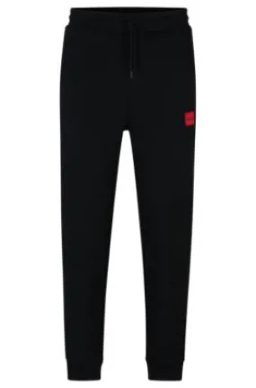 Pantalones de chándal en felpa de algodón con etiqueta con logo roja